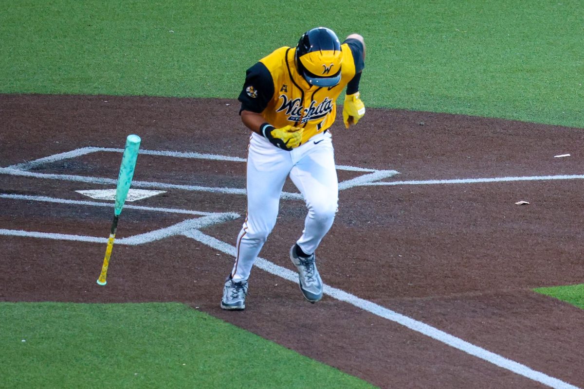 Wichita State baseball senior Jaden Gustafson (21) runs to first base against Tulane on April 2 at Eck Stadium. Gustafson hit 1-for-4 against the Green Wave.