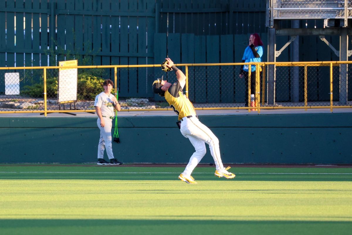 Wichita State baseball junior Owen Rush (43) catches a popup in the outfield grass from his second base position against Tulane on April 2 at Eck Stadium. Rush started his ninth straight game for the Shockers in the 4-2 loss.