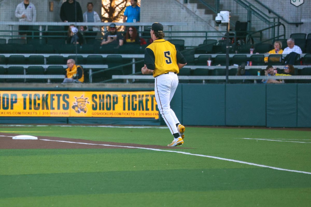 Wichita State baseball junior Reese Kortum (5) runs out of the bullpen against Tulane on April 2 at Eck Stadium. Kortum came in for relief during the fifth inning.