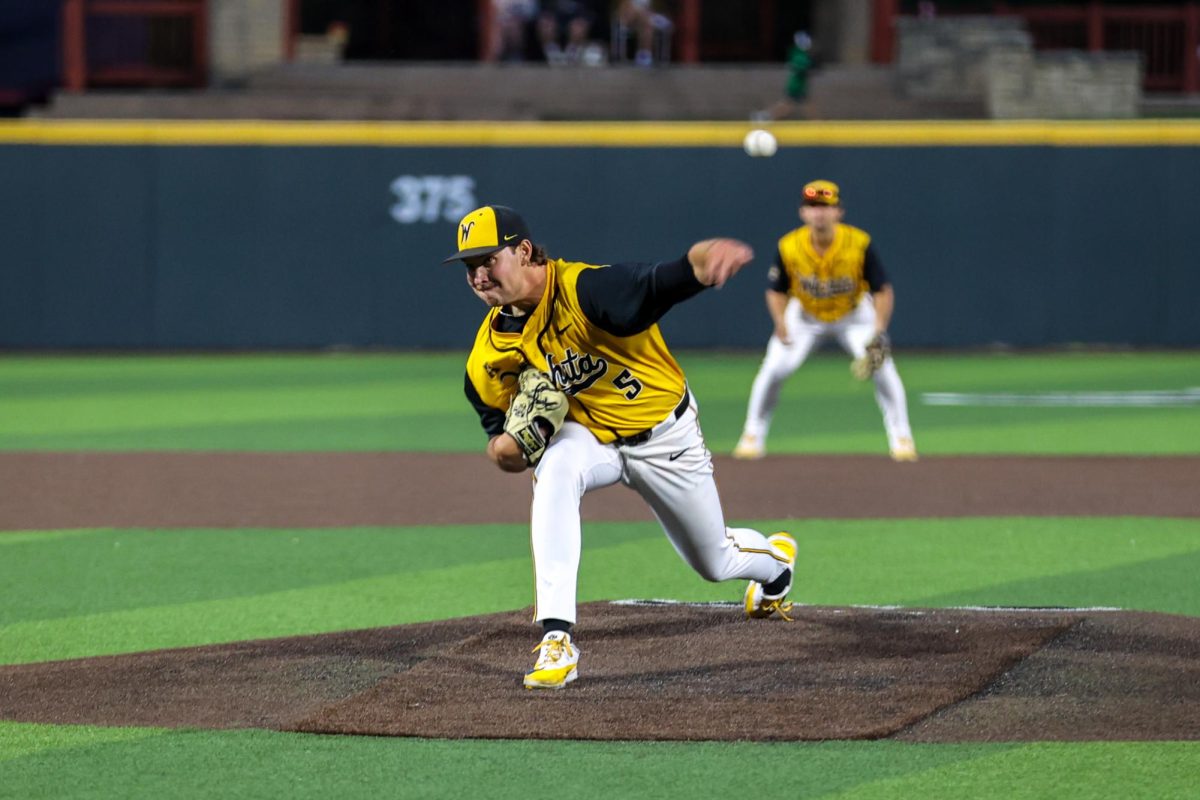 Wichita State baseball junior Reese Kortum (5) slings a pitch against Tulane on April 2 at Eck Stadium. Kortum struck out three batters and gave up one run on three hits in 2 1/3 innings of relief.