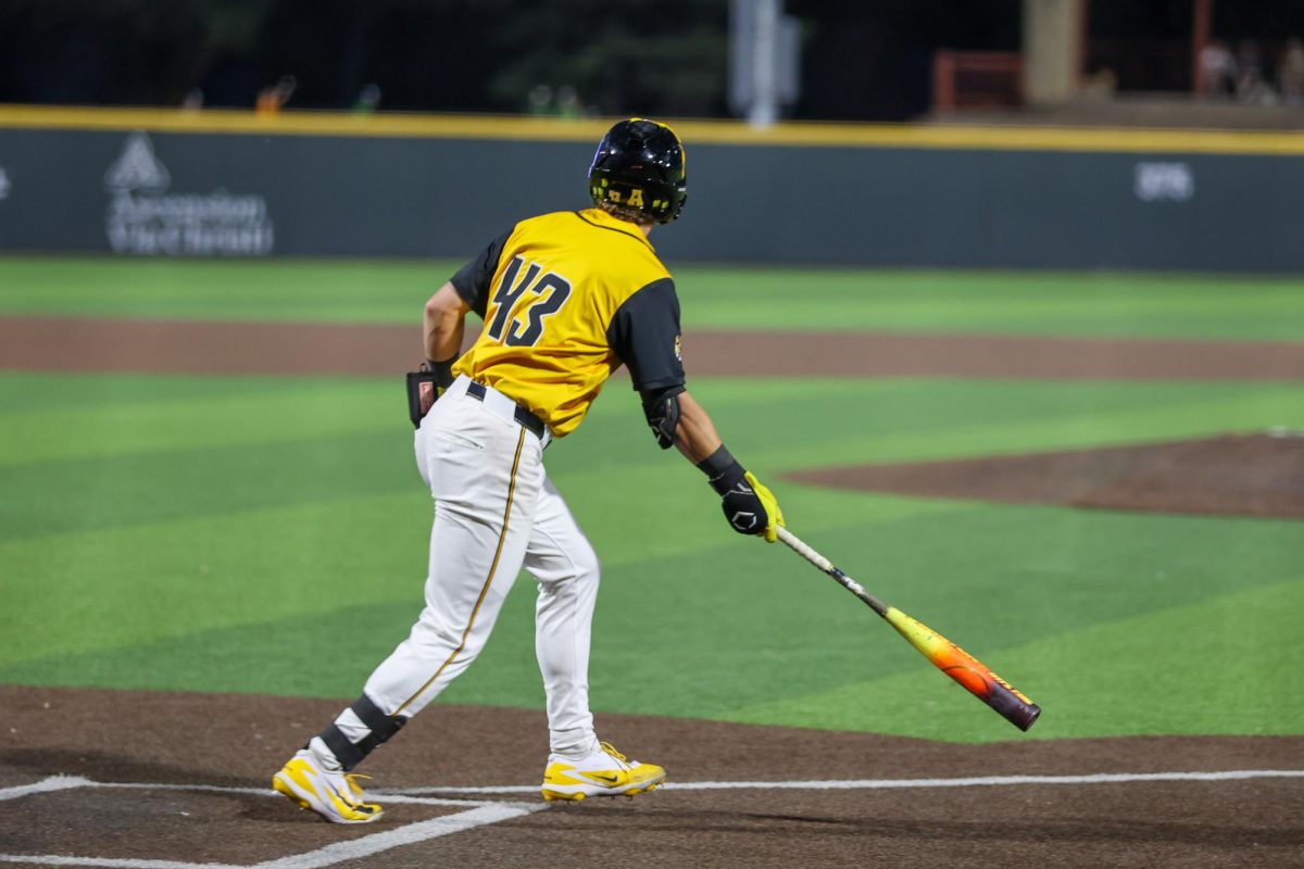Wichita State baseball junior Owen Rush (43) watches the ball after making contact against Tulane on April 2 at Eck Stadium. Rush hit 0-for-2 against the Green Wave.