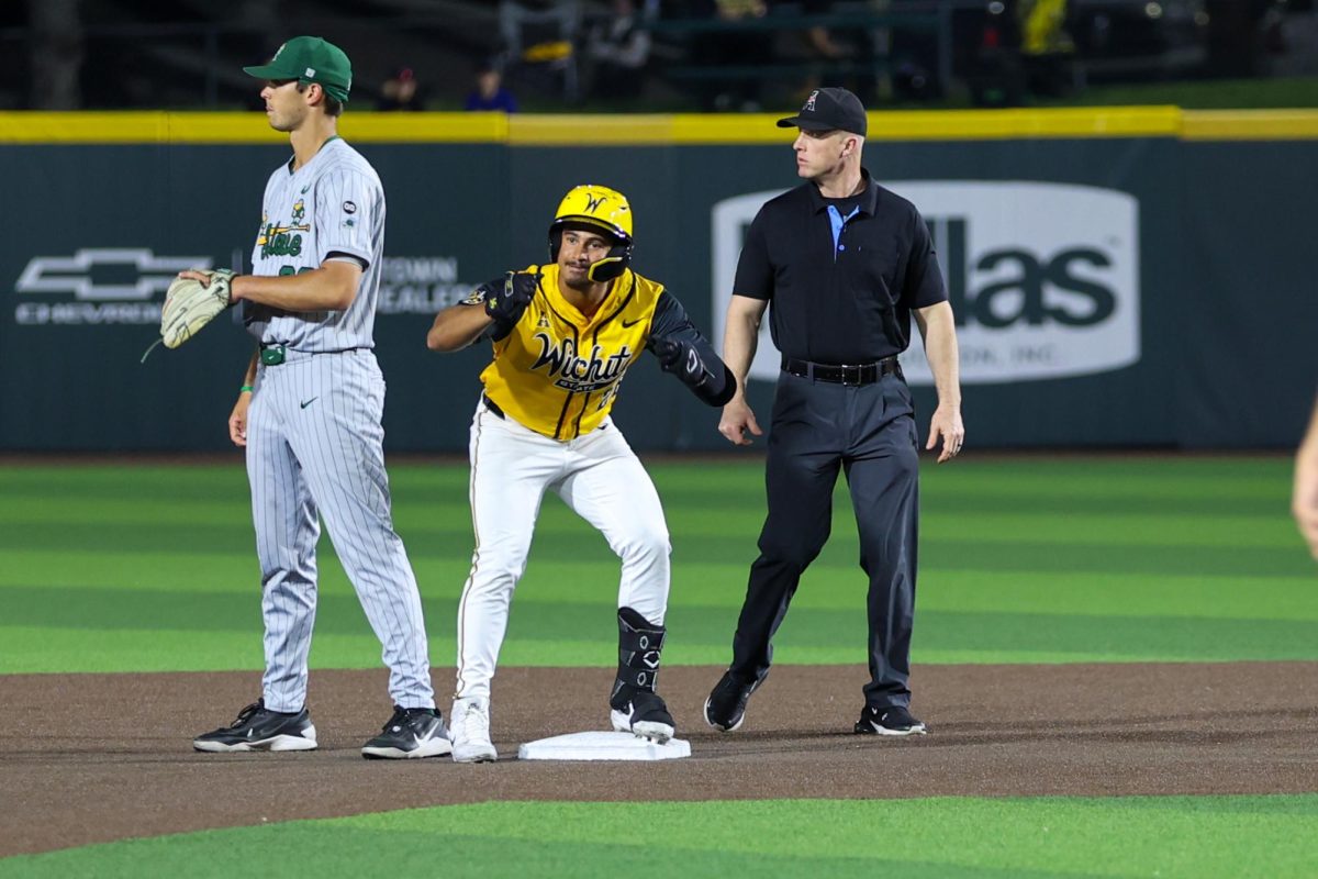Wichita State baseball junior Kaleb Duncan (26) celebrates after hitting a double in the ninth inning against Tulane on April 2 at Eck Stadium. The Shockers fell, 4-2, in the series opener.