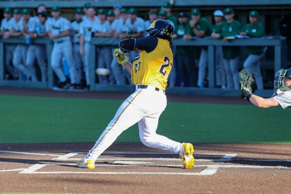 Wichita State baseball senior Jacob Gutierrez (27) takes a swing against Tulane on April 2 at Eck Stadium. Gutierrez hit 0-for-5 in the 4-2 loss. (File photo)