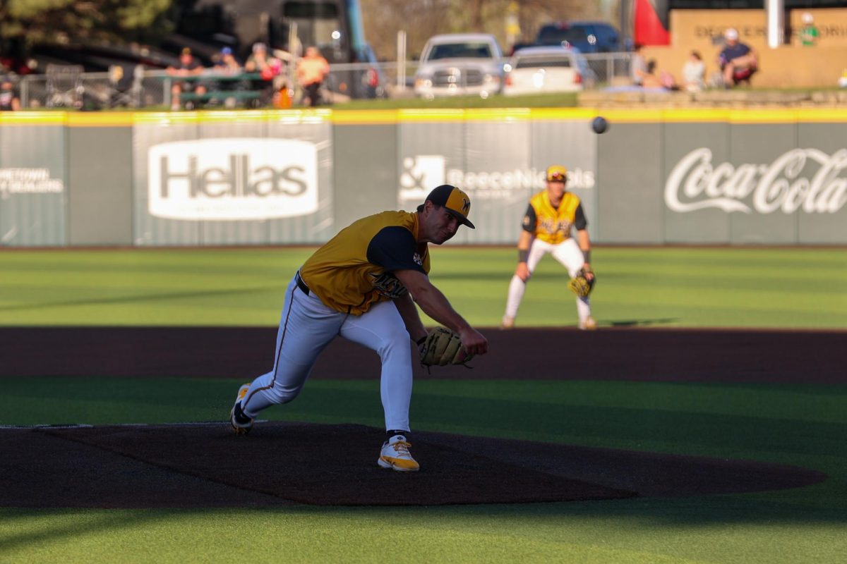 Wichita State baseball junior Matthew Cuccias (18) throws to a Tulane batter on April 2 at Eck Stadium. Cuccias gave up three runs on six hits and was tagged with his first loss this season.