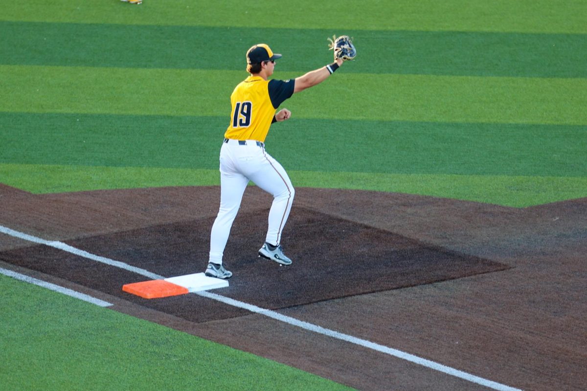 Wichita State baseball junior Jack Quick (19) makes a catch while standing on first base against Tulane on April 2 at Eck Stadium. Quick made four put outs in the game.