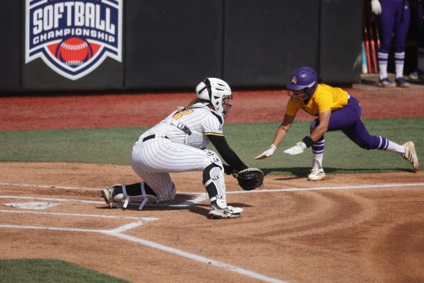 Wichita State softball sophomore catcher Aeryn Shuman (78) goes to tag an East Carolina base runner out at home plate during the American Conference Championship semifinals on May 8 at Joyner Family Softball Stadium in Greenville, N.C. (Photo courtesy of Wichita State Athletics)