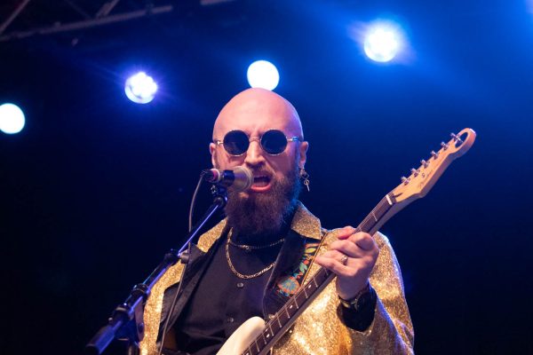 Zac Rasmussen of Wasay Oblique takes charge of the stage Wednesday at WAVE's Battle of the Bands. Wasay Oblique is a psychedelic funk rock band.
