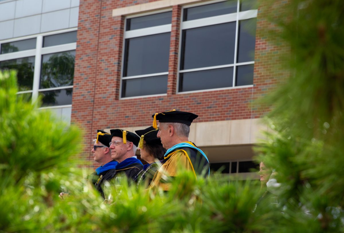 Wichita State deans sit on the RSC east patio during the ceremony. There was a dean from every college on campus present.