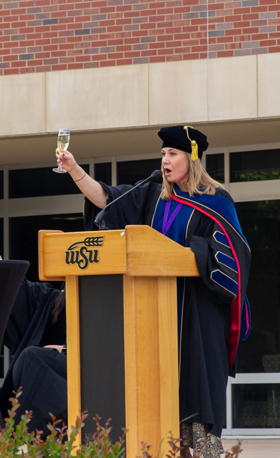Provost Monica Lounsbery raises a glass to the class of 2026. Lounsbery told graduates to believe they were ready to join the ranks of almuni during her speech.