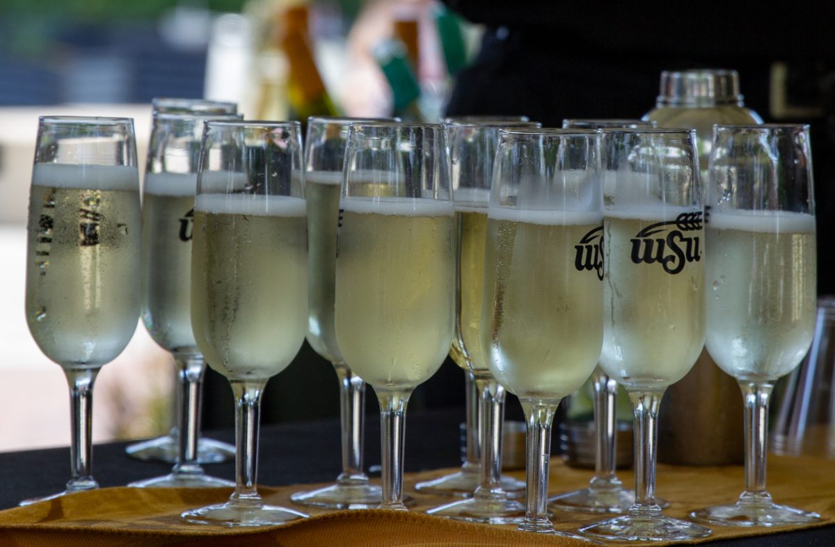 WSU-branded champagne flutes sit on a table during The Toast. These were given to attendees before the event.