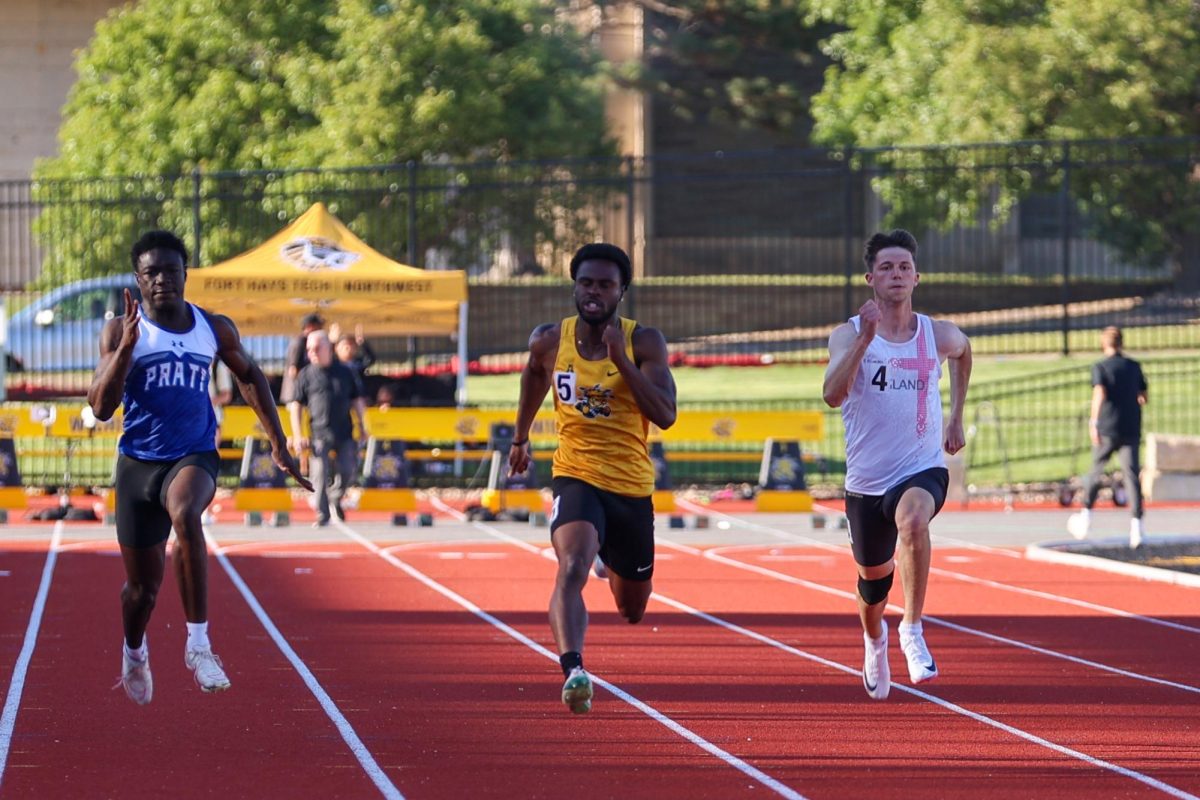 Wichita State track and field sophomore Chairo Ogbebor leads the pack in the fifth section of the men's 100-meter dash at the Shocker Open on May 8 at University Stadium. Ogbebor finished the event in first place with a time of 10.17 seconds.