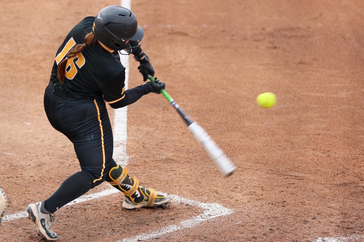 Wichita State softball junior first baseman Trinity Allen (16) swings at a pitch against Memphis on May 1 at Wilkins Stadium. Allen went 3-for-3 with four RBIs during the game.