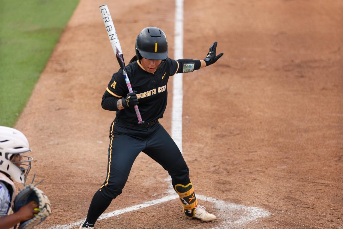Wichita State softball senior shortstop Chloe Rhine (1) calls for time in the batter's box against Memphis on May 1 at Wilkins Stadium. Rhine was walked in all three of her plate appearances.