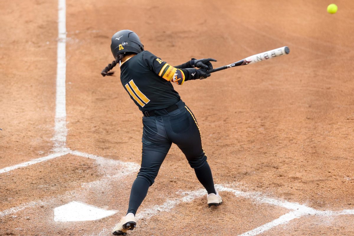 Freshman Mackenzie Rooney sends a ball up the middle. Rooney went 1-2 from the plate.