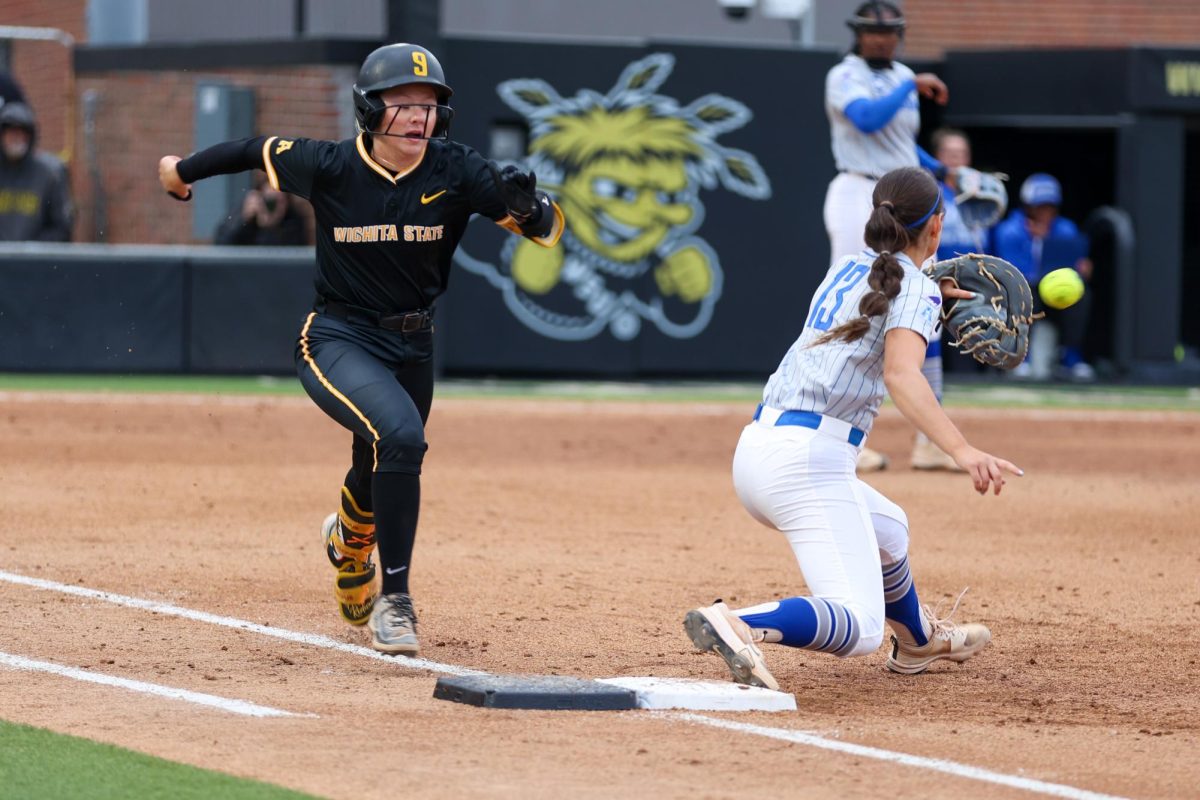 Wichita State softball freshman second baseman Kammie Smith (9) runs out a throw at first base against Memphis on May 1 at Wilkins Stadium. Smith went 1-for-3 as the Shockers' leadoff hitter.