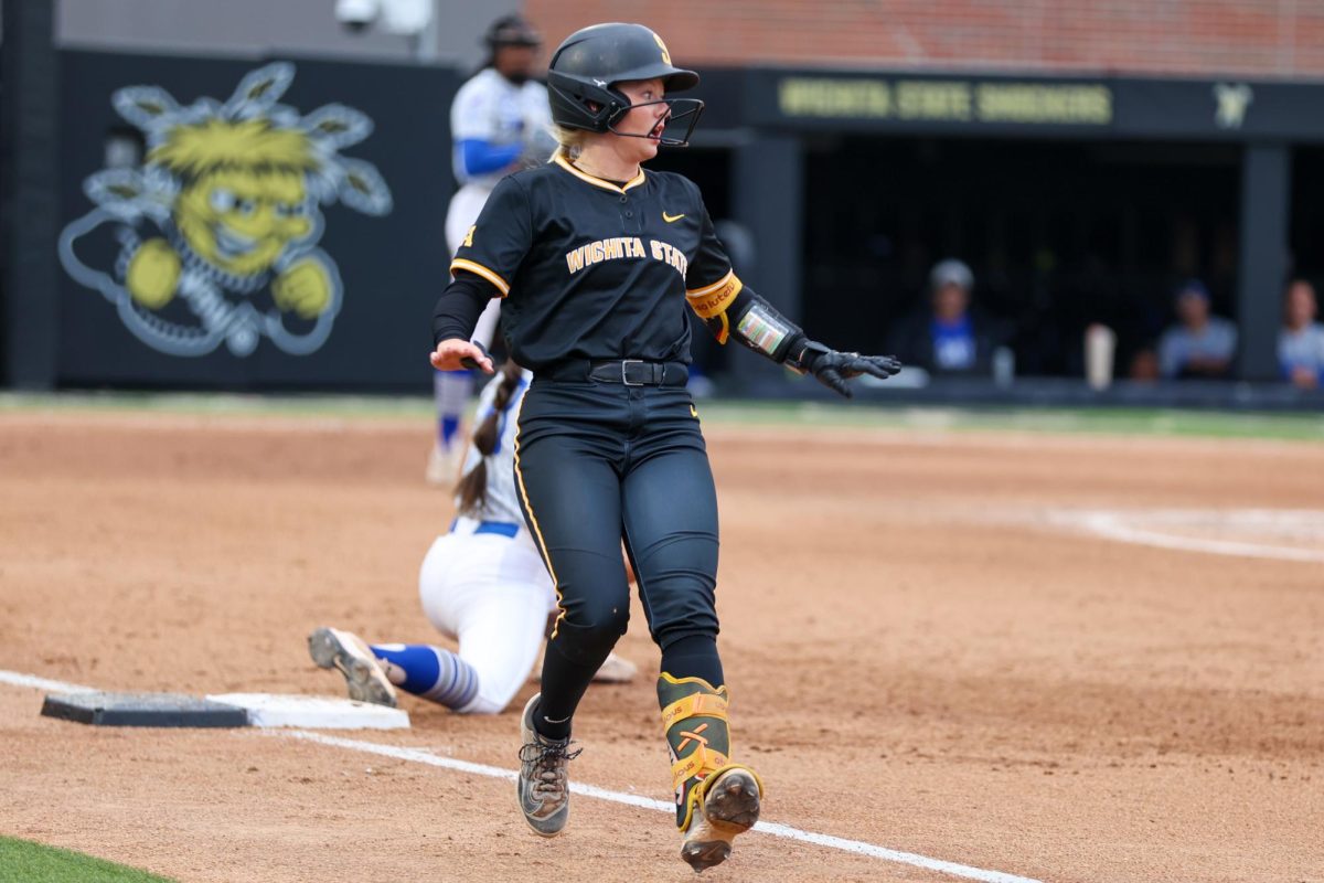 Wichita State softball freshman second baseman Kammie Smith (9) looks to the first base umpire for a call against Memphis on May 1 at Wilkins Stadium. Smith was called out on the play.