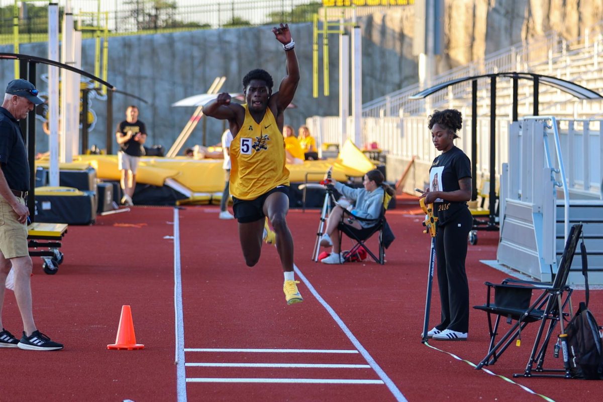 Wichita State track and field sophomore Kelvin Acheampong takes his first leap during the triple jump at the Shocker Open on May 8 at University Stadium. Acheampong's third attempt, a mark of 15.14 meters, won him the event. 
