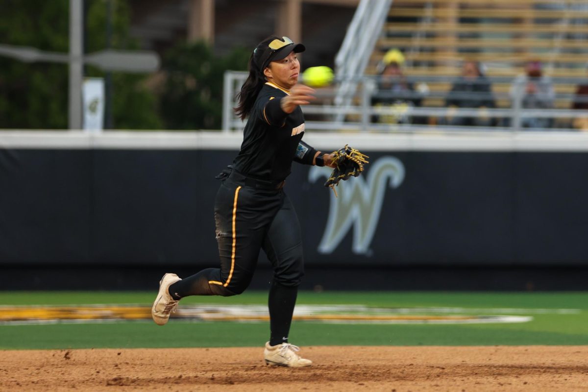 Wichita State softball senior shortstop Chloe Rhine (1) rifles the ball to first base against Memphis on May 1 at Wilkins Stadium. Rhine finished the game with one put out and three assists.