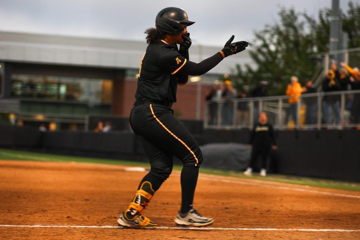 Wichita State softball sophomore Ausha Moore (81) dances before crossing home plate against Memphis on May 1 at Wilkins Stadium. Moore scored twice in the Shockers' 15-2 win.