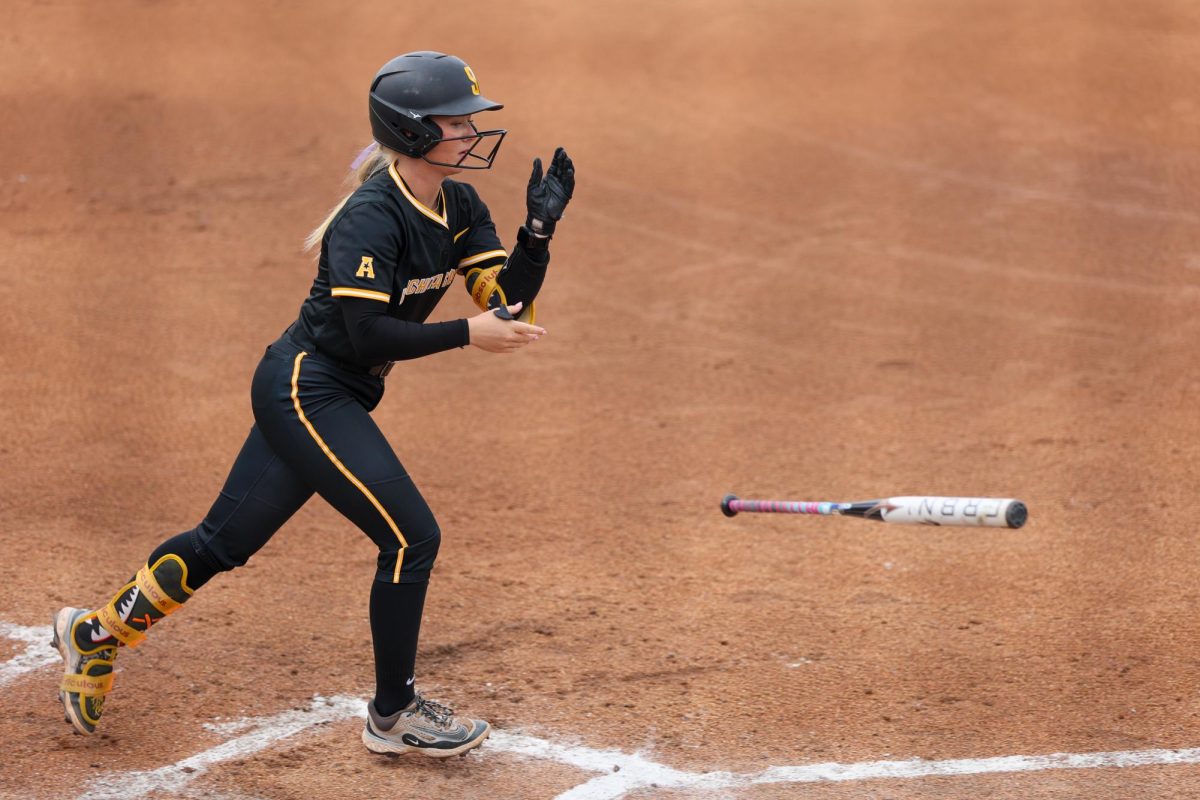 Wichita State softball freshman second baseman Kammie Smith (9) flips her bat after being walked against Memphis on May 1 at Wilkins Stadium. The Shockers coerced 11 walks during the 15-2 win.